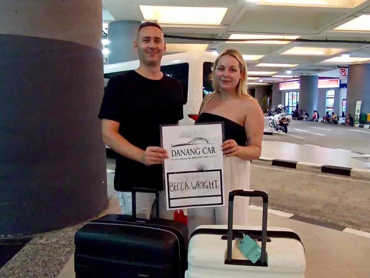 VnCarRentals driver holding a welcome sign at Cam Ranh Airport