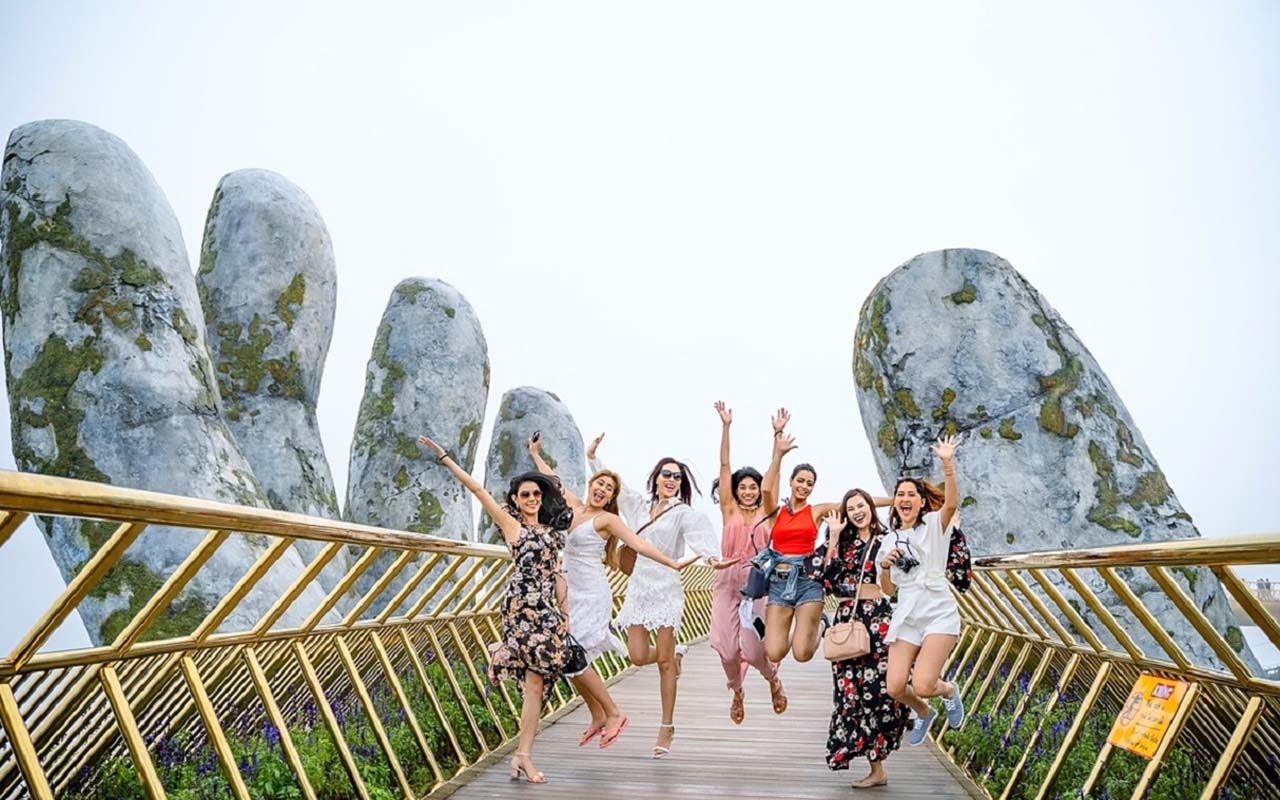 The Golden Bridge at Ba Na Hills with its signature moss-covered hands and panoramic views of the forest and Da Nang City.