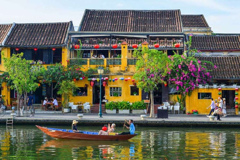 Lively street scene in Hoi An Ancient Town showcasing traditional architecture and bustling markets.