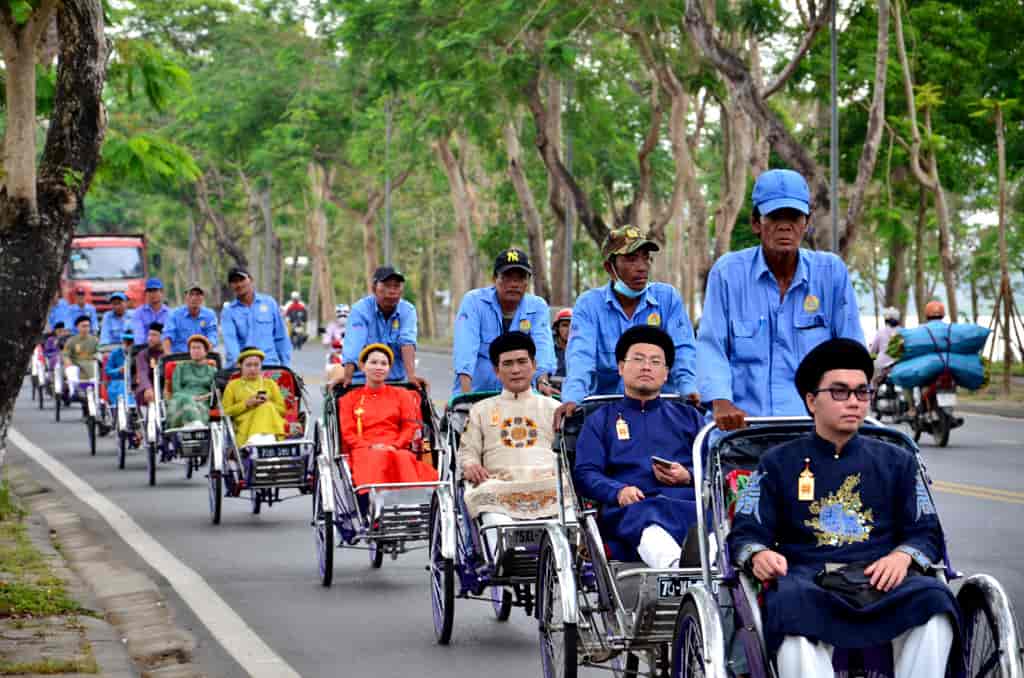 A traditional cyclo ride through the Imperial City of Hue, showcasing the historic architecture and serene atmosphere.