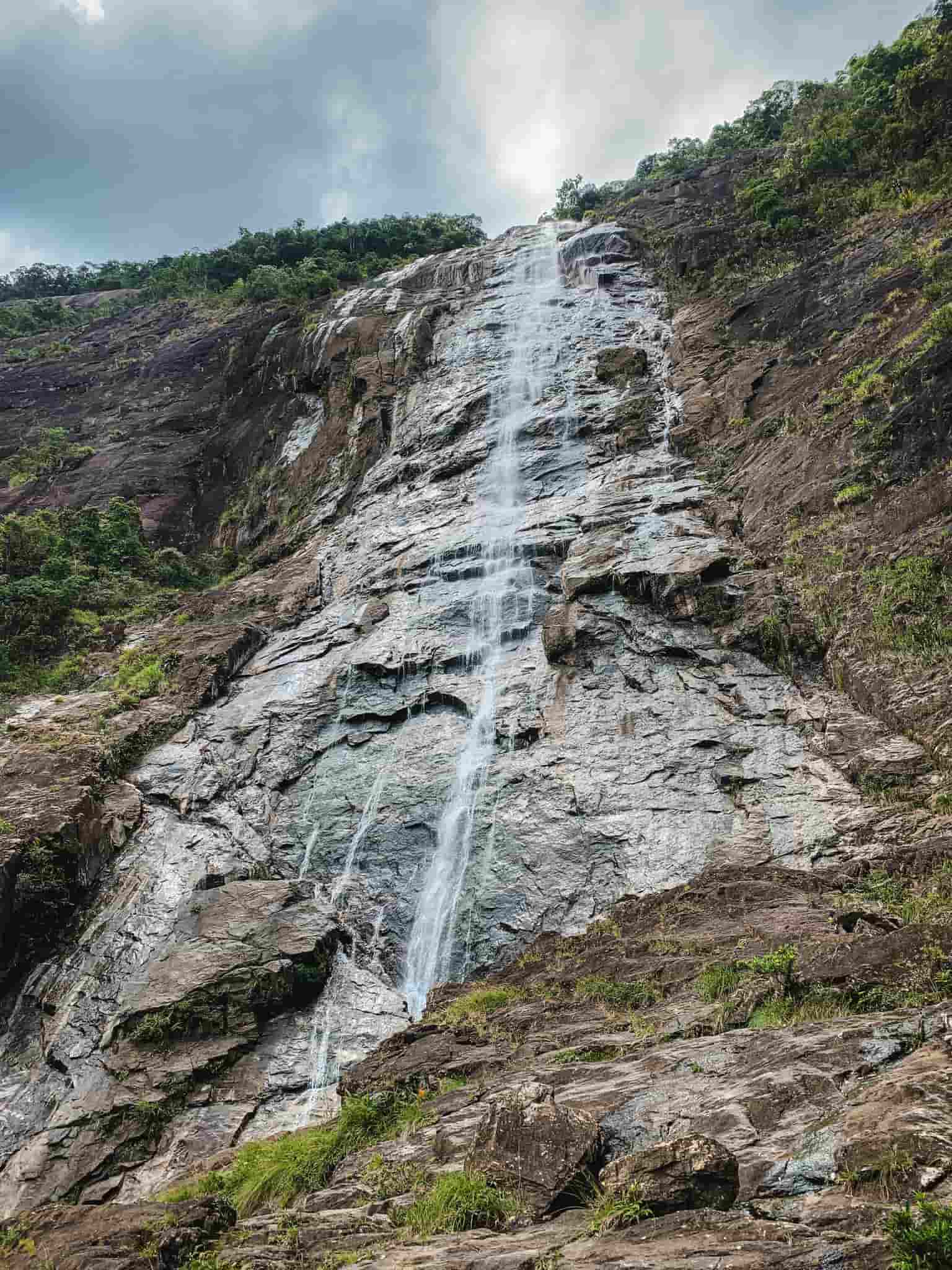 A stunning view of Do Quyen Waterfall cascading down the rocks in Bach Ma National Park.