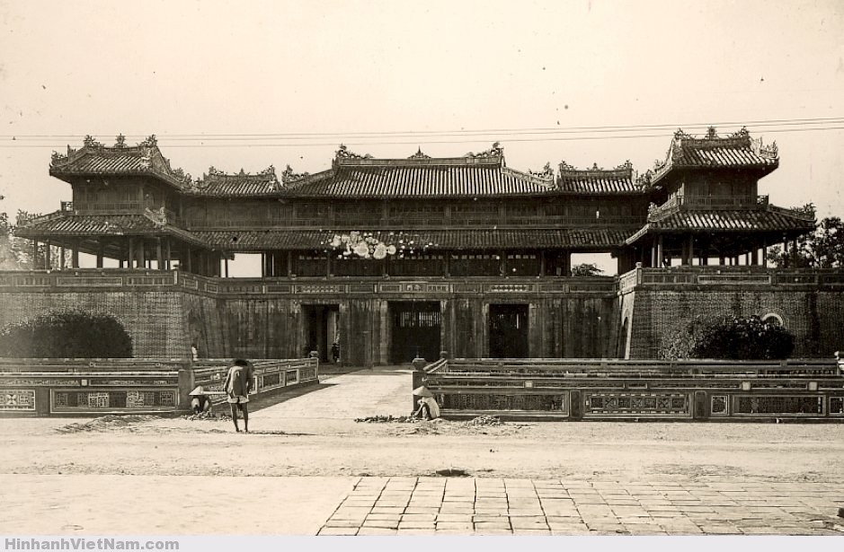 A historical view of the Imperial City of Hue, showcasing its grand architecture and scenic surroundings by the Perfume River.