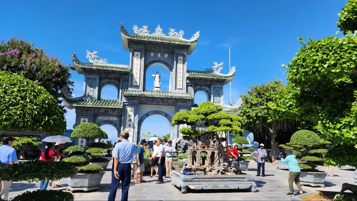 Panoramic view of Linh Ung Pagoda on Son Tra Mountain in Da Nang with sea and forest background.