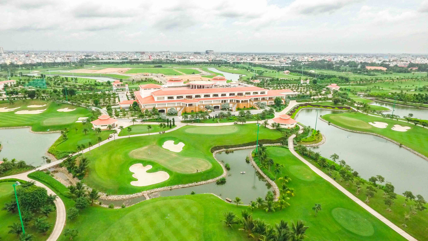 Long Biên Golf Course in Hanoi, featuring sloping terrain and challenging holes designed by Nelson & Haworth