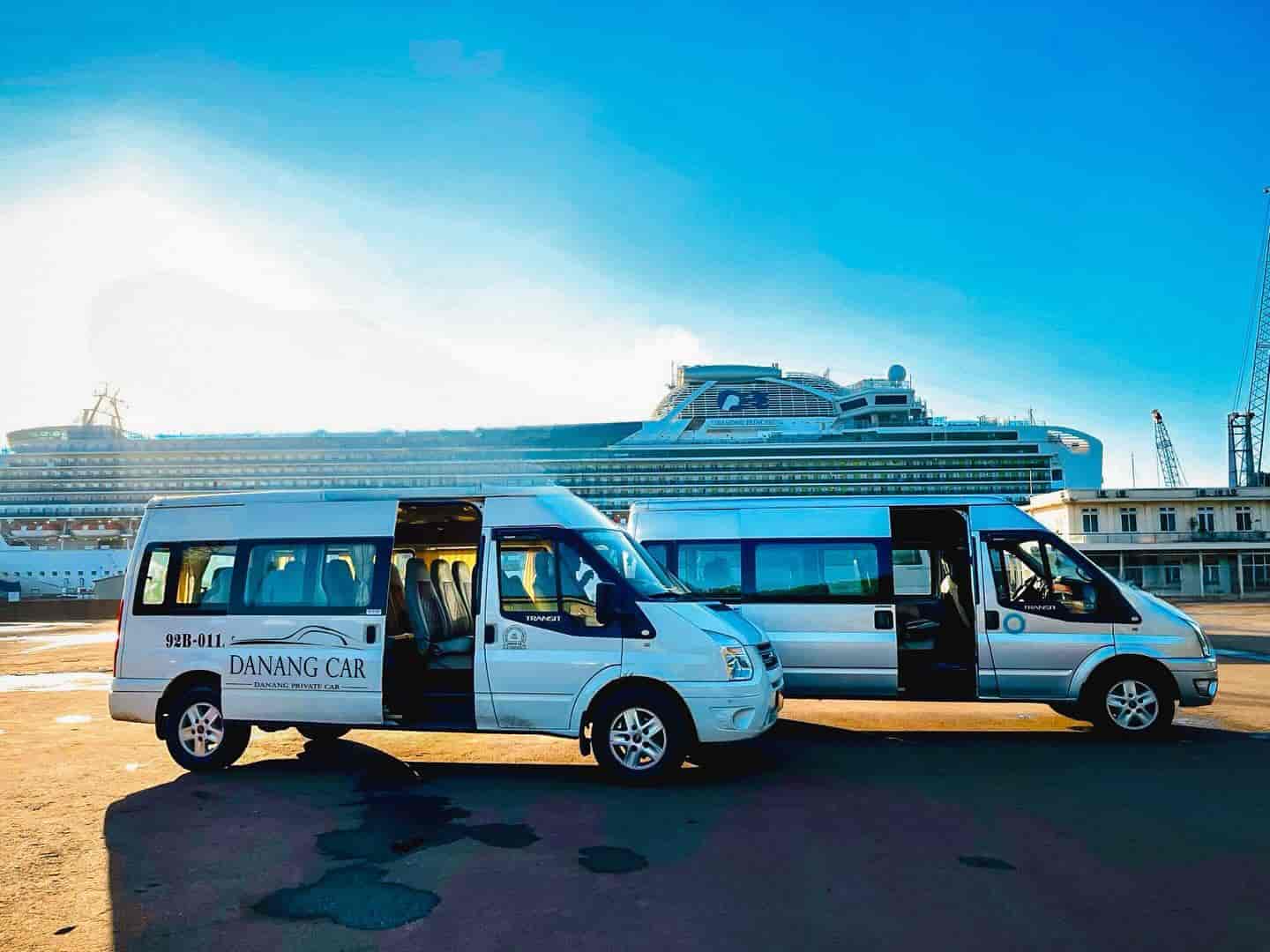 VnCarRentals.com vehicle parked at Tien Sa Port, showcasing the private car hire service with a professional driver ready to assist travelers.