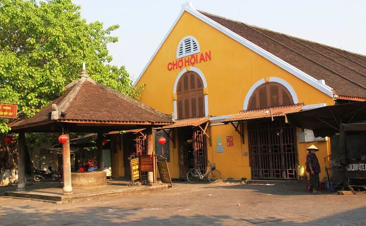 Unique French-style architecture of Hoi An Market with tiled roofs and colorful designs.