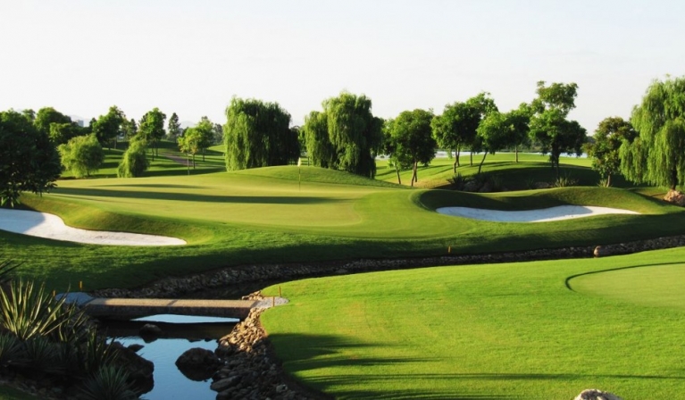 Vân Trì Golf Club in Đông Anh, Hanoi, with lush greenery and water features, designed by Peter Rousseau